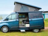 An Auto-Sleeper Air on Ford Transit Custom with its roof raised