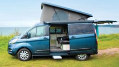 An Auto-Sleeper Air on Ford Transit Custom with its roof raised