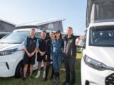 The Marquis team and Julia Bradbury standing in front of two Panama campervans