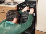 A technician checking the burn and the cut-off of the cooker