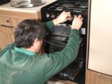 A cooker being serviced by a technician