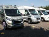 Motorhomes lined up in storage