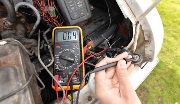 A multimeter showing a reading of 0.04A