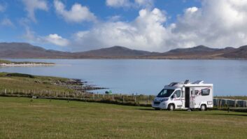 A motorhome parked by water