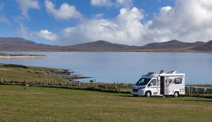 A motorhome parked by water