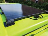 A solar panel on the roof of a campervan