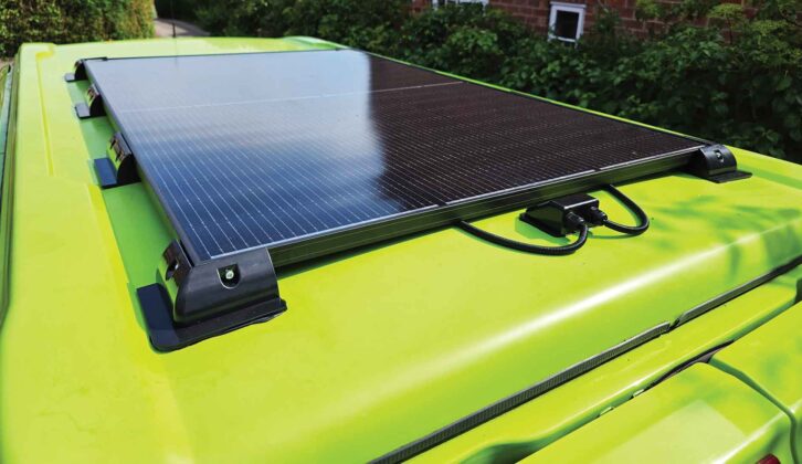 A solar panel on the roof of a campervan