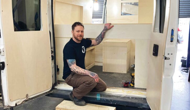 John inside a van in the process of being converted