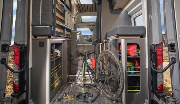 A bike being stored beneath the rear bed