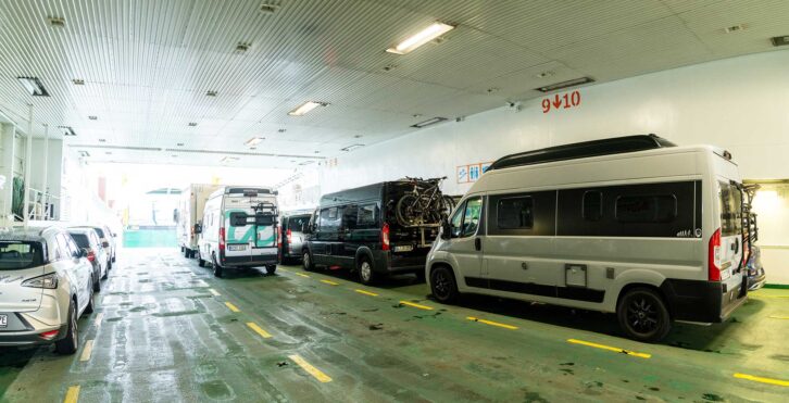 Vans waiting to leave a ferry