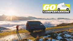 A man by a parked campervan taking in the view