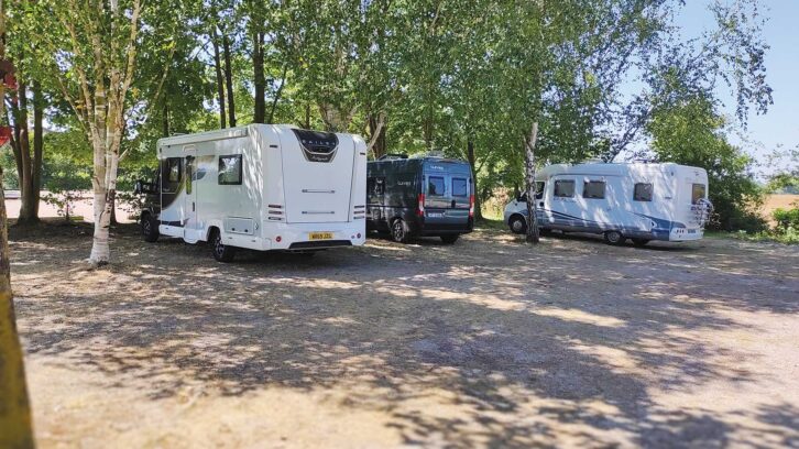 Campervans and motorhomes at an Aire