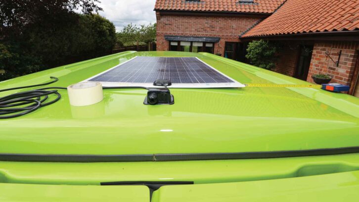 A solar panel on the roof of a campervan