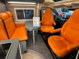 The orange "Noto" eco-leather upholstery on the seats