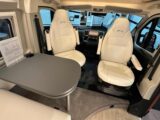 The cab seats in white "Carrara" eco-leather