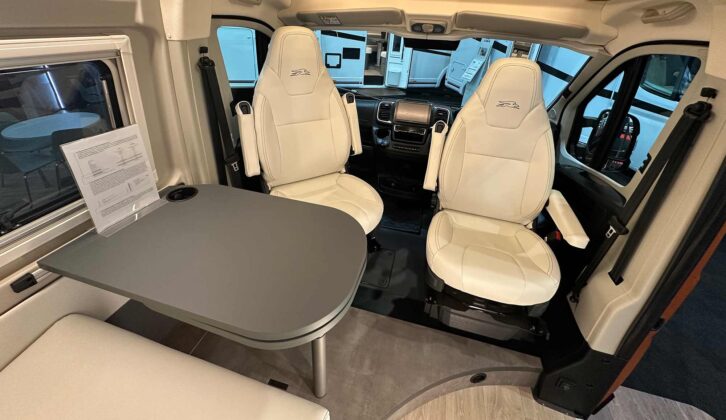The cab seats in white "Carrara" eco-leather
