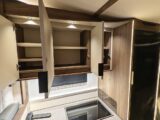 Empty kitchen cupboards in a motorhome