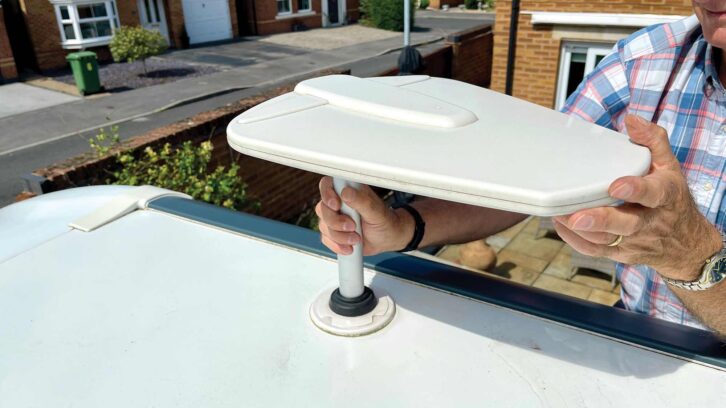 Lift out the original TV antenna and coaxial cable