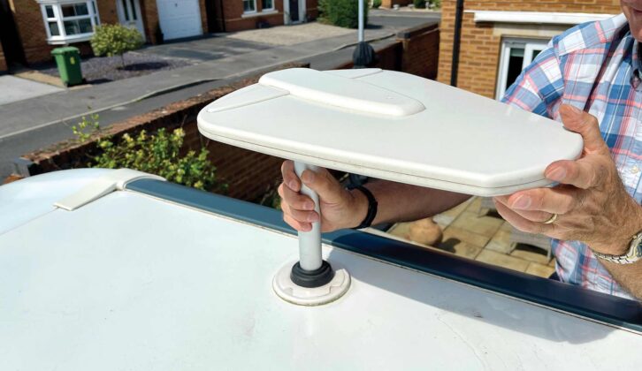 Lift out the original TV antenna and coaxial cable