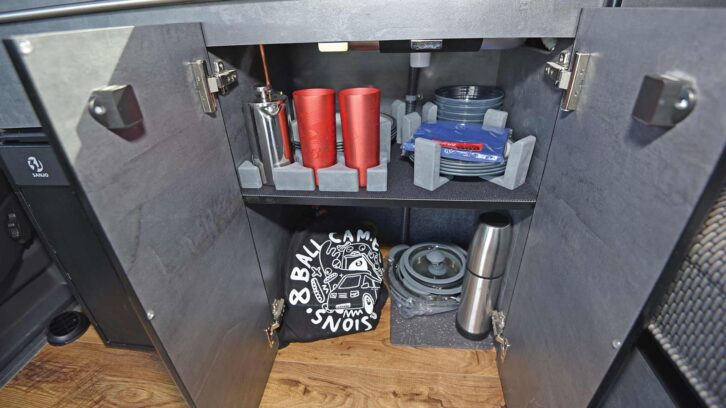 A crockery cupboard in a motorhome