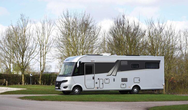 An A-class motorhome at a quiet campsite