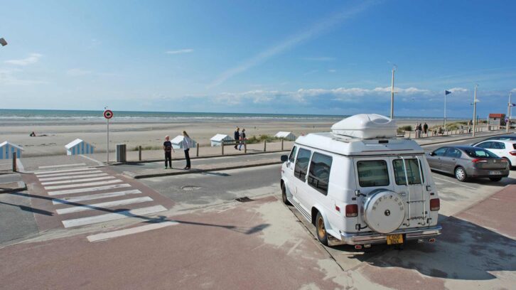 A campervan parked up on a beach