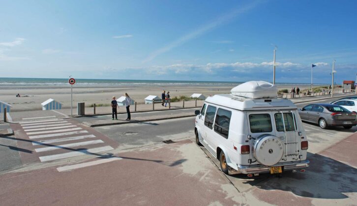 A campervan parked up on a beach