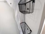 Two wire baskets in the washroom