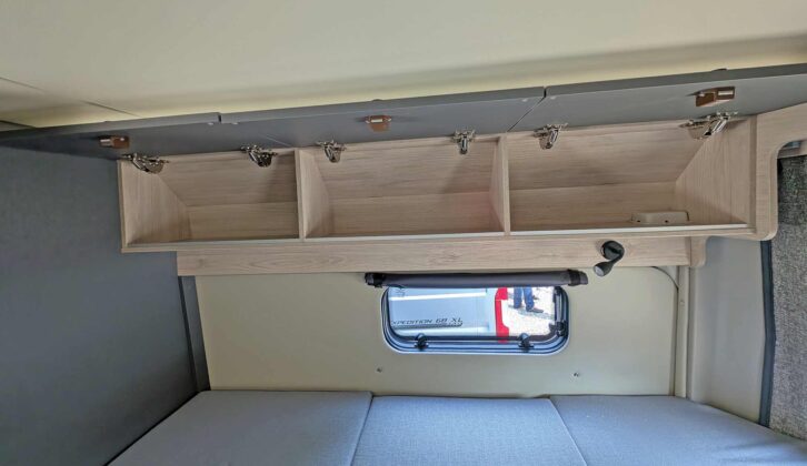 Overhead lockers above the bed