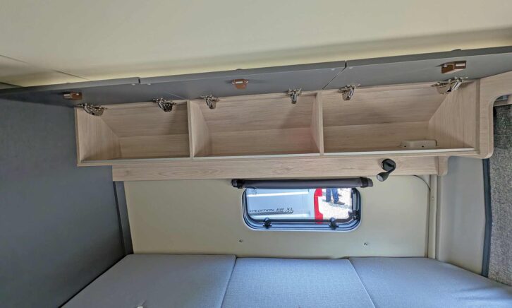 Overhead lockers above the bed