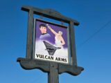 The pub sign for the Vulcan Arms