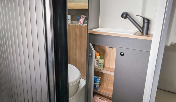 The washroom, with its space-saving tambour door