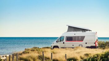 The 60G with its roof raised, parked by the sea