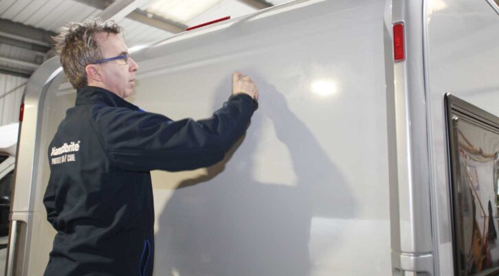 A professional applying a Nano ceramic paint protectant