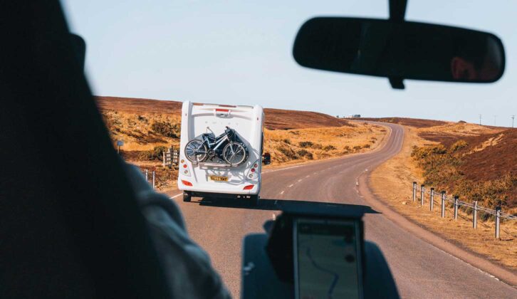 Looking through the windscreen to see a motorhome on the road ahead