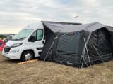 The campervan pitched up with an awning