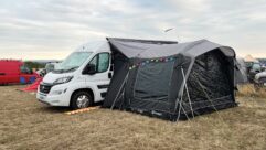 The campervan pitched up with an awning