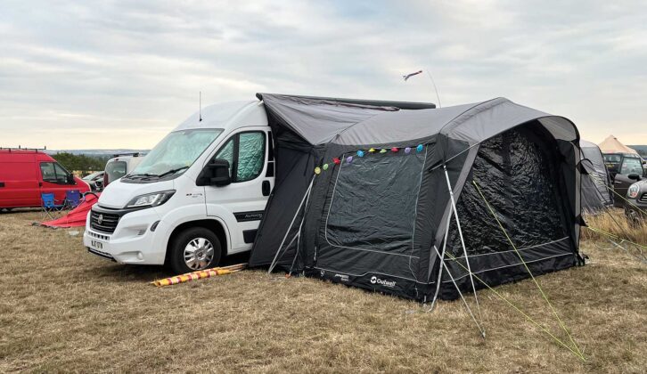 The campervan pitched up with an awning