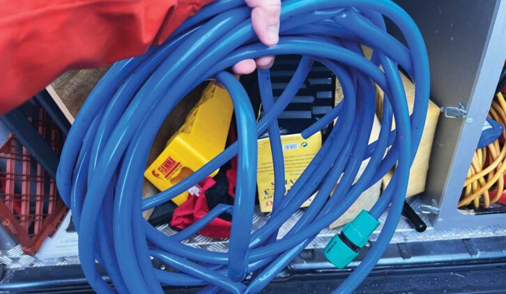 A food-grade hose being held