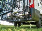 The parked and 'jacked' motorhome with a bike rack on the rear