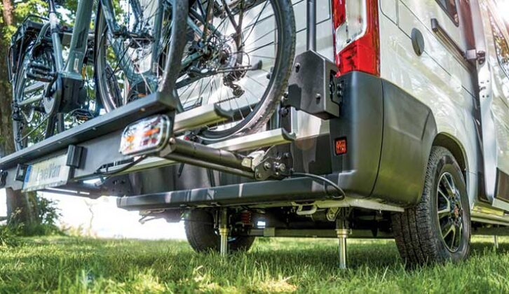 The parked and 'jacked' motorhome with a bike rack on the rear
