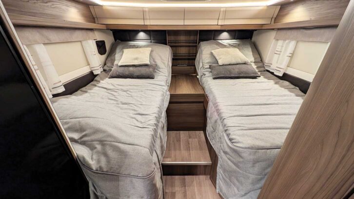 Both twin beds raised for reading