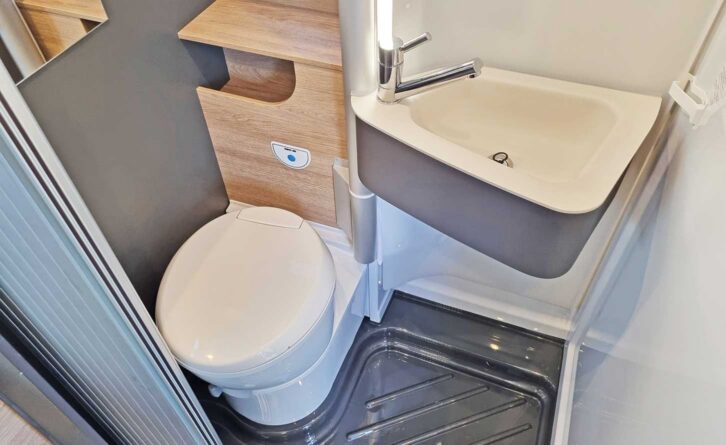 A washroom with twin shower tray drain holes