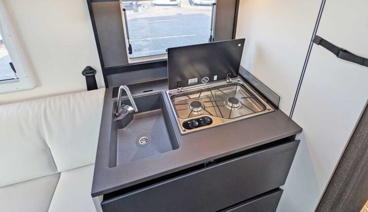 The kitchen with its sink and hob