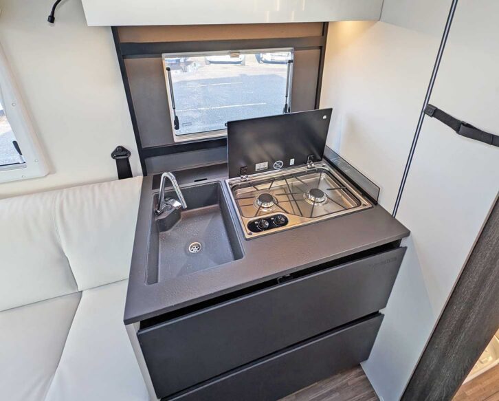 The kitchen with its sink and hob