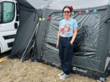 Sarah standing by her campervan and awning at Twinwood Vintage Festival