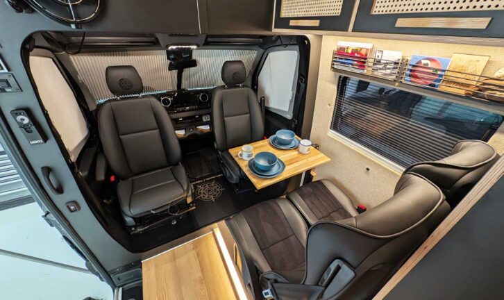 The front lounge includes a clip-on table