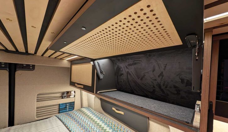 One of the cupboards above the bed