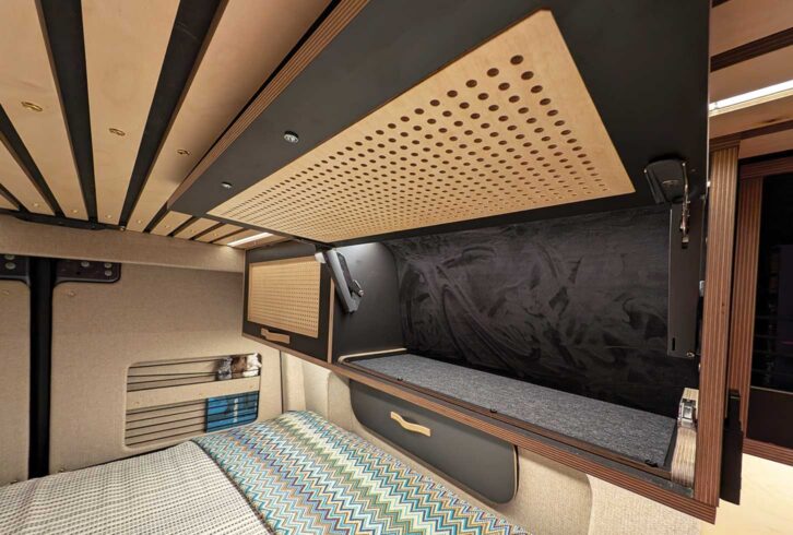 One of the cupboards above the bed