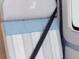 A nearside forward-facing travel seat